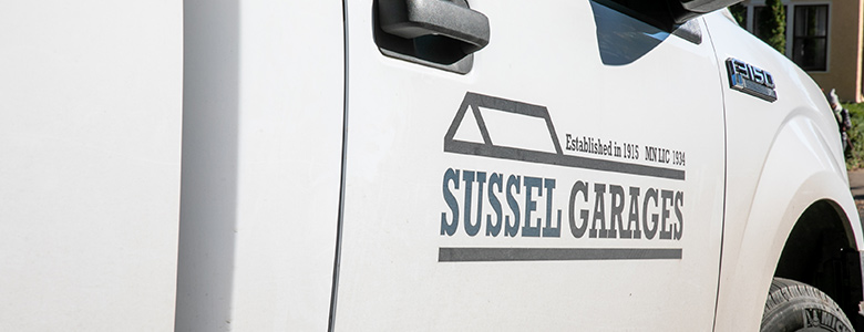Close up shot of Sussel Garage truck logo.