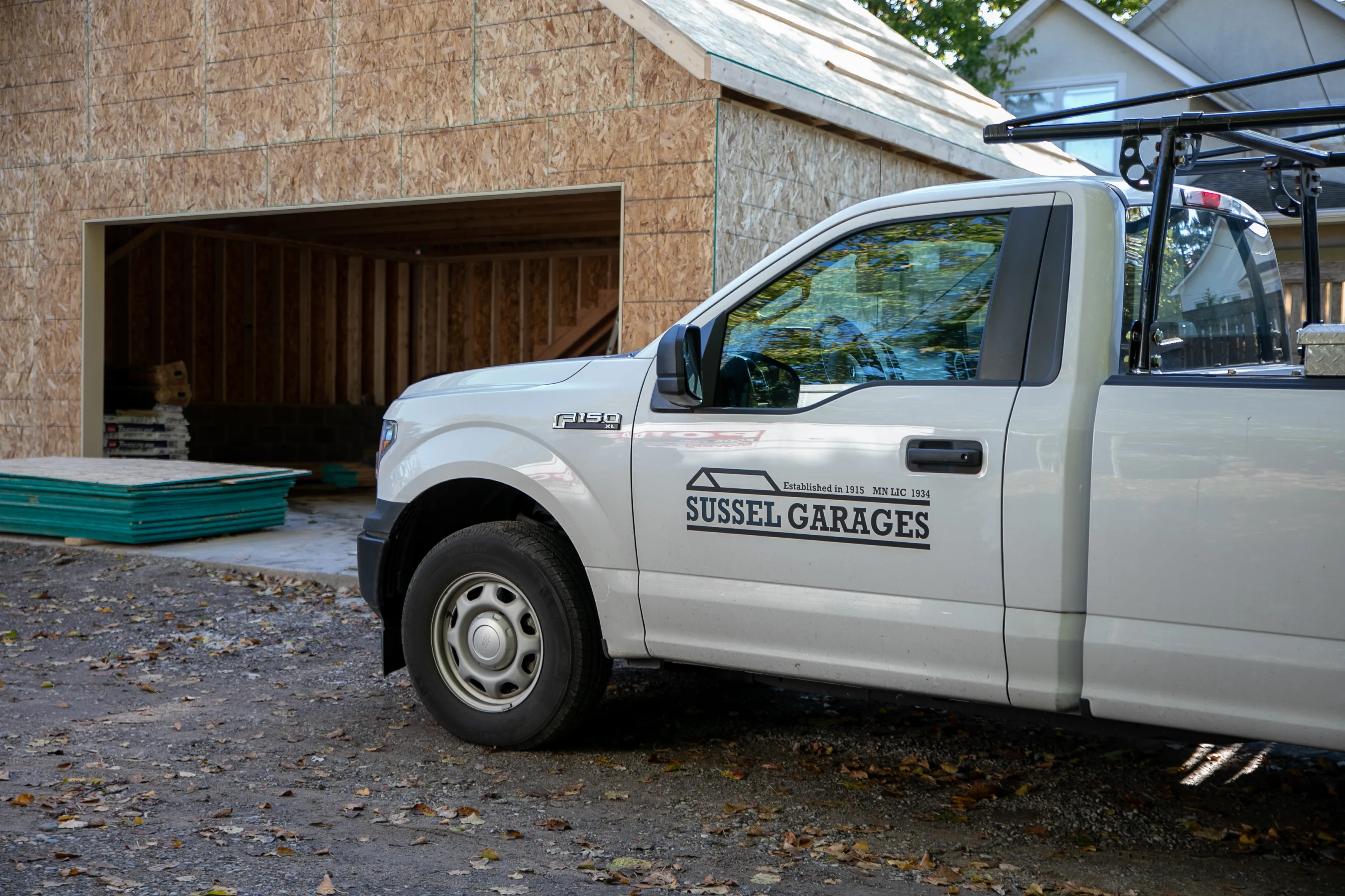Sussel Garages work truck beside a new detached garage under construction